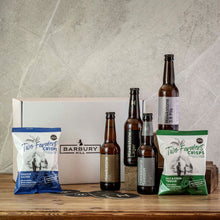 Load image into Gallery viewer, A Barbury Hill gift box featuring four bottles of Hawkstone Beer and two bags of Two Famers Crisps in a Barbury Hill box, arranged on farmhouse table.
